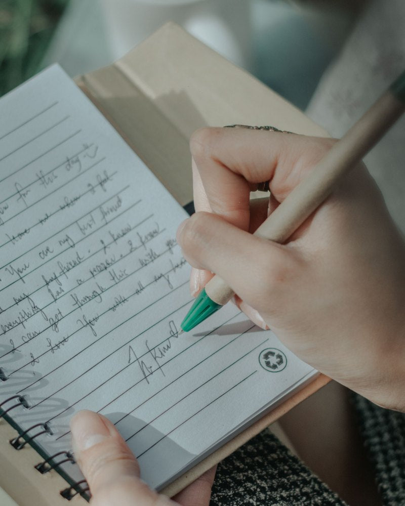 Journaling in a notebook — a calm moment of reflection